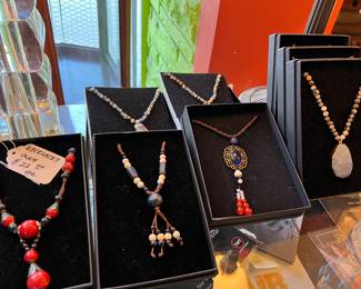 Some very nice necklaces, lots of retro jewelry pieces, some sterling & stainless. We also have dozens of rings, bracelets, and more necklaces! Fun costume jewelry!