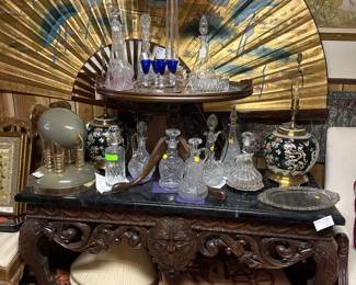 Console table with Greenman, Rugs, Crystal Decanters, Lamps & Asian Wall Fan