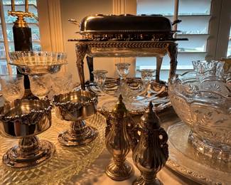 Lots of mid-century silver-plate items by Wallace, Baroque pattern.