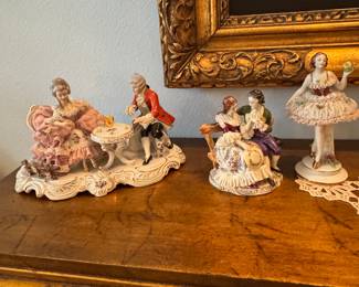 Several beautiful Dresden Lace porcelain figures for sale.