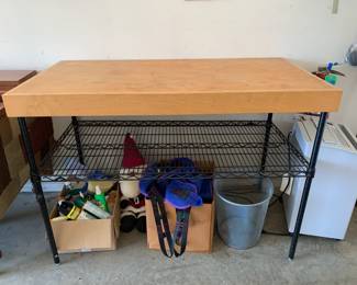 #148	Wood top table with a metal base 1  shelf 49x25x35	 $75.00 			
