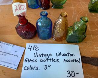 #282	vintage 3" Wheaton color bottles (4)	 $30.00 			

