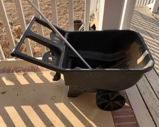 #134	green plastic wheelbarrow 	 $20.00 			

