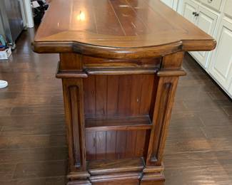 #8	Hand-crafted Pine Wood Island w/2 doors w/shelf (on either side), 3 drawers ,  and 2 baskets   72x27x38	 $425.00 			
