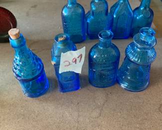 #297	vintage 3" Wheaton blue bottles (4)	 $30.00 			
