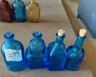 #299	vintage 3" Wheaton blue color bottle  (4)	 $30.00 			
