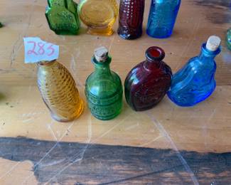 #283	vintage 3" Wheaton color bottles (4)	 $30.00 			

