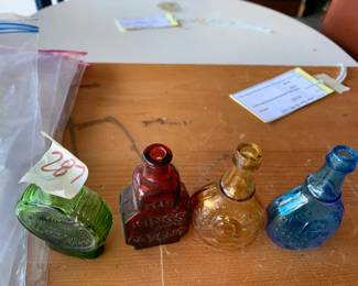 #287	vintage 3" Wheaton color bottles (4)	 $30.00 			
