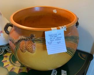#105	Roseville USA Pine Comb 403-10 Brown Dual Handled Pot (as is chip)	 $75.00 			
