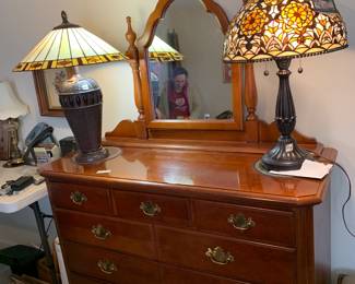 #84	Reproduction Dell Tiffany Ltd. Edition Lamp w/double pull w/Flower Design - 28" Tall	 $125.00 			
#85	Reproduction Dell Tiffany Lamp - 25" tall	 $100.00 			
#86	Stanley 7 Drawer Dresser w/Mirror - 49x20x40  Mirror - 46x29 (as is top finish)	 $175.00 			
