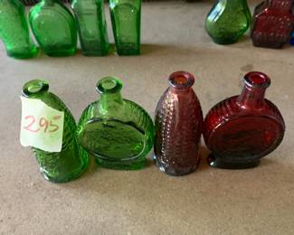 #295	vintage 3" Wheaton green and red bottles (4)	 $30.00 			
