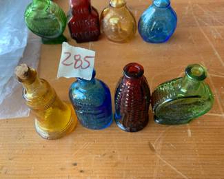 #285	vintage 3" Wheaton color bottles (4)	 $30.00 			
