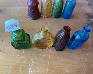 #284	vintage 3" Wheaton color bottles (4)	 $30.00 			
