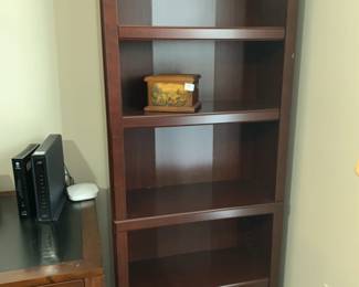 #64	Laminate Bookcase w/4 shelves  - 30x12x72	 $45.00 			
