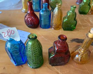 #280	vintage 3" Wheaton  color bottle (4)	 $30.00 			
