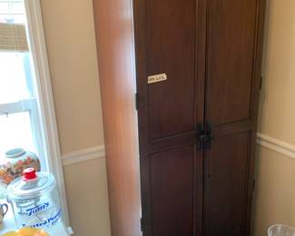 #10	Howard Miller wine and Bar Ham-ton Cherry Finish Wood  Cabinet 27x17x72 w/2 doors, Glass Rack w/12 Holder for 12 wine bottles w/1 drawer w/key	 $225.00 			
