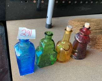 #291	vintage 3" Wheaton color bottles (4)	 $30.00 			
