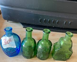 #300	vintage 3' WHEATON  green and blue bottles (4)	 $30.00 			
