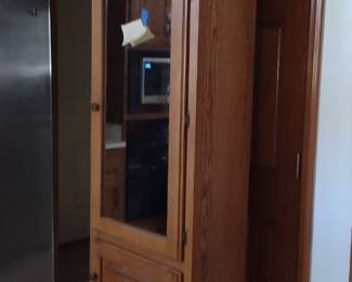 Oak Storage Cabinet $120 with cabinet door mirror and hooks inside for storage.
