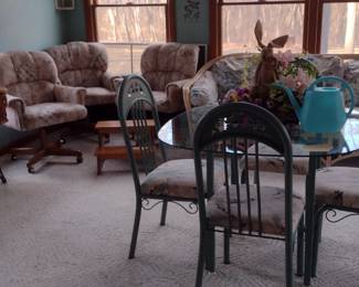 Sewing Machine in cabinet $5, Glass & Metal table and 4 chairs $5, Sunroom Couch & Matching Loveseat $5 each.