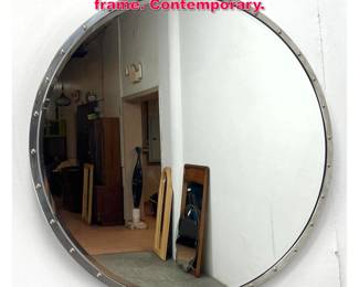 Lot 493 Round Wall Mirror with metal riveted frame. Contemporary.