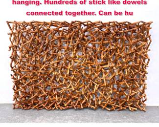 Lot 561 Large Assembled Wood stick wall hanging. Hundreds of stick like dowels connected together. Can be hu