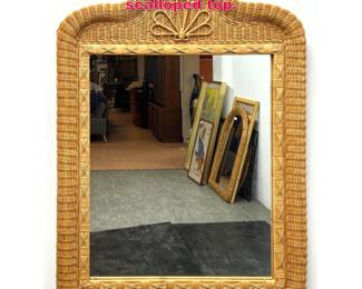 Lot 479 Wicker wall mirror with scalloped top.