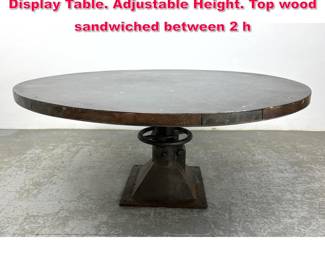 Lot 74 Very Large Industrial Steel Dining Display Table. Adjustable Height. Top wood sandwiched between 2 h