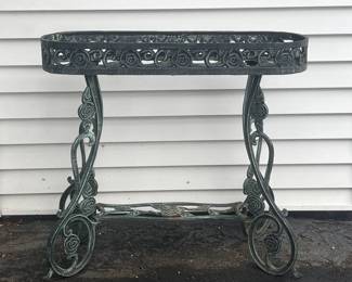 One of two cast iron plant stands