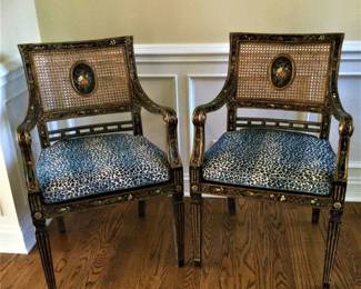 A Pair of Regency Style Black Lacquer Parcel Gilt Caned Armchairs