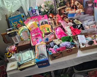 LOTS of Barbie dolls, Barbie clothes & accessories. Most are still new in box. Other dolls & accessories as well.