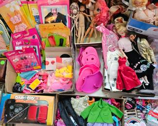 LOTS of Barbie dolls, Barbie clothes & accessories. Most are still new in box. Other dolls & accessories as well.