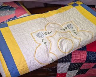 Large selection of vintage and modern handsewn quilts