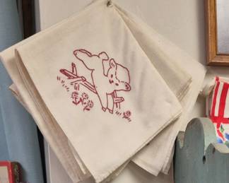 Large selection of vintage linens, flour and feed sacks and embroidered towels