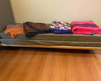 Twin wooden bed frame with two mattress pads 