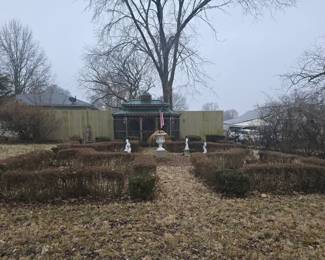 Set of four painted and cast cement dolphin fountain ornaments on partial painted metal plinths 