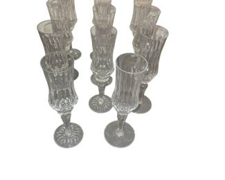 Assembled set of 11 Galway cut crystal champagne flutes seven with star cut bases, four plain bases. 