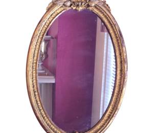 Tilden-Thurber Carved giltwood oval mirror. Rhode Island. With label. 19th C.