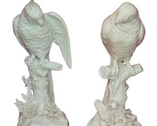 Pair of Continental Blanc de Chine parrots. One with under-glazed blue crossed mark. 