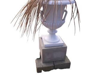 Painted cast iron urn on stone plinth