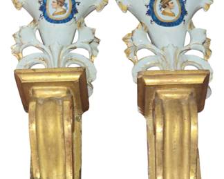 Pair of carved giltwood corbels with English porcelain vases. 19th Century. 