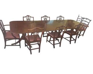 A Classical style carved mahogany 3 pedestal dining table with 2 additional leaves. Second half  19th Century.