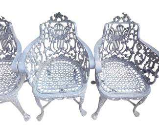 Close up of black painted cast aluminum garden chairs