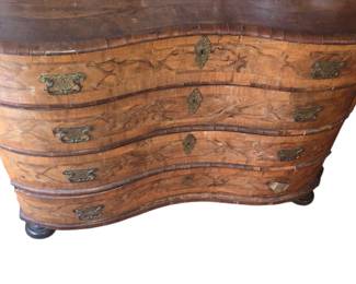 A German baroque walnut inlaid commode. Mid 18th Century