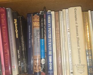 Bookcase with collection of books on antiques, travel, foreign languages and auction catalogues