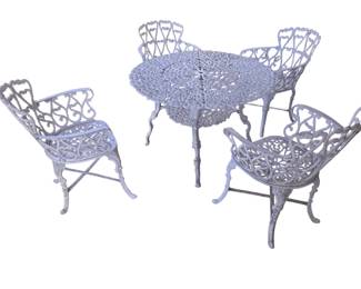 White painted cast iron five piece set with four armchairs and a table.