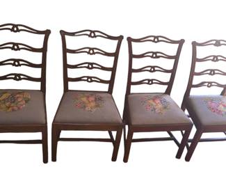 Set of four Chippendale style carved mahagony ladderback side chairs