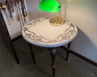 Gorgeous Hollywood Regency style Marble-top Table with gilded inlay and Brass detailed Legs