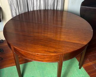 Pair of demi-lune tables placed together. Perfect for a small home, or if you are doing large scale formal dinners... a child's table or serving tables. So elegant; the possibilities.