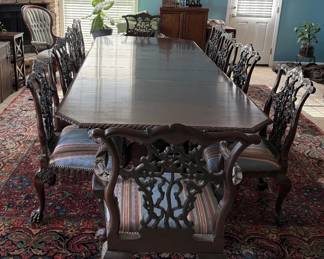 Massive dining room table and 12 heavily carved dragon paw handled Victorian Chippendale Chairs. Centennial era circa 1870's. Wow. Just, Wow!